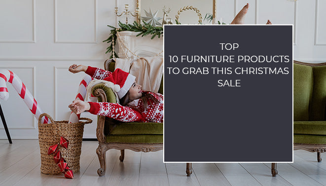 Woman relaxing on a vintage green sofa with Christmas decor, representing top 10 furniture products to grab this sale.