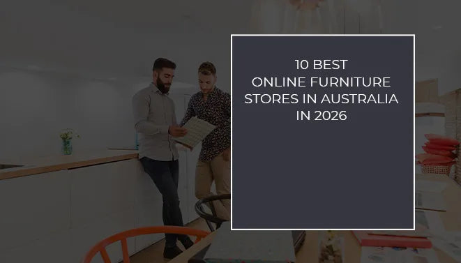 Two men reviewing furniture catalogs in a modern showroom, representing the best online furniture stores in Australia for 2026.