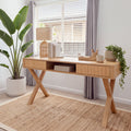 Arden 140cm Home Office Desk Natural in a light study by a window, with a rattan lamp, books and trailing plants