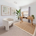 Arden 140cm Home Office Desk Natural in a study with a white boucle armchair, a jute rug and framed abstract prints, wide view