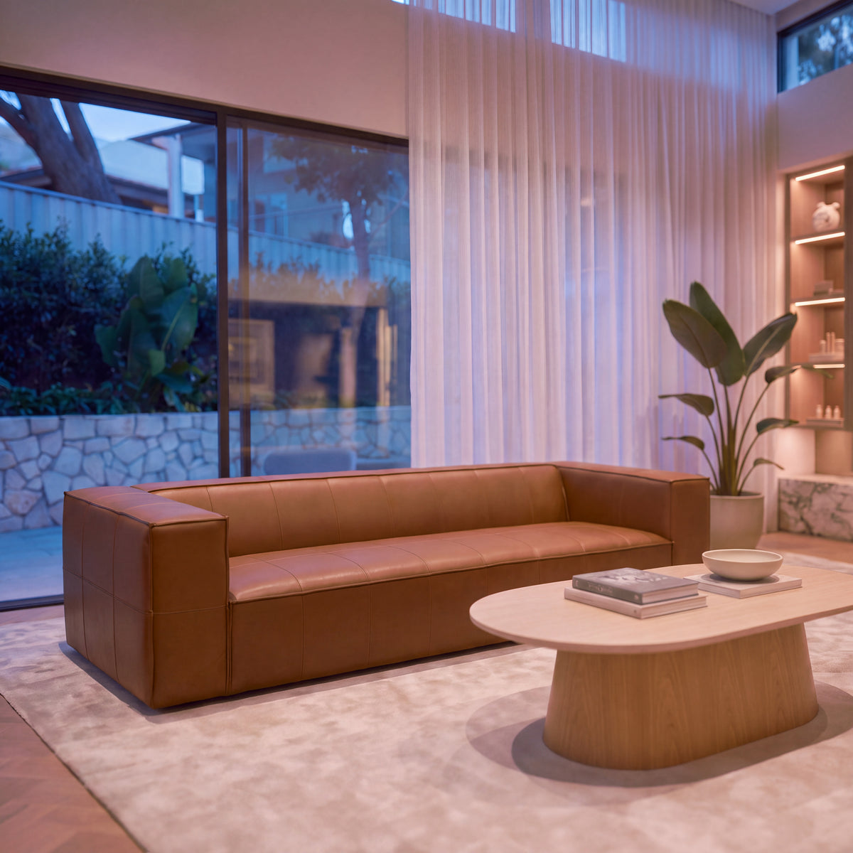 Atlantis 4 Seater Sofa Tan, styled in a living room, front three-quarter view