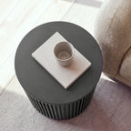 Ayla Fluted 40cm Round Side Table Black seen from above, with a cup on a linen book on the round top