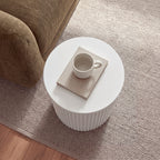 Ayla Fluted 40cm Round Side Table White seen from above beside a sofa, with a mug on a book