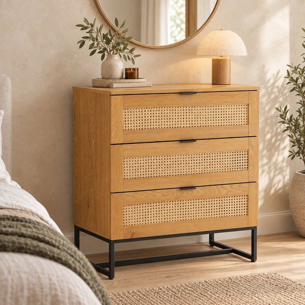 Debora 80cm Tallboy Chest of 3 Drawers Oak, in a bedroom beneath a round mirror