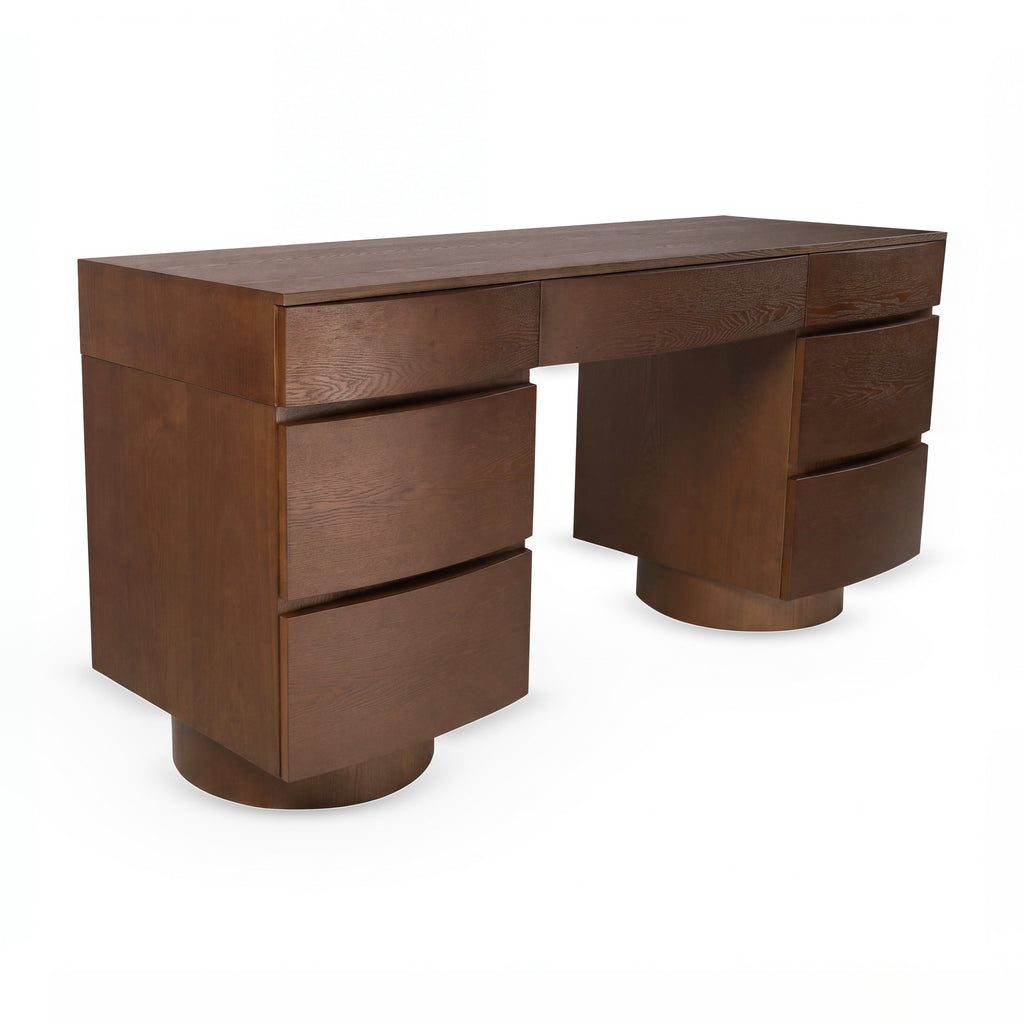 Dorit 172cm 7 Drawer Home Office Desk Walnut, three-quarter view on a white background showing seven curved drawer fronts over two round plinths