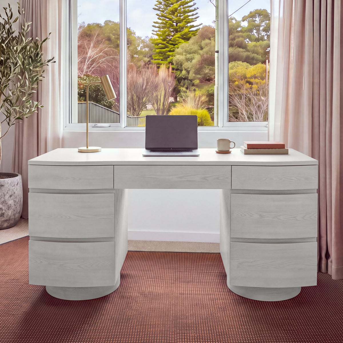 Dorit 172cm 7 Drawer Home Office Desk White, front view against a window with sheer pink curtains
