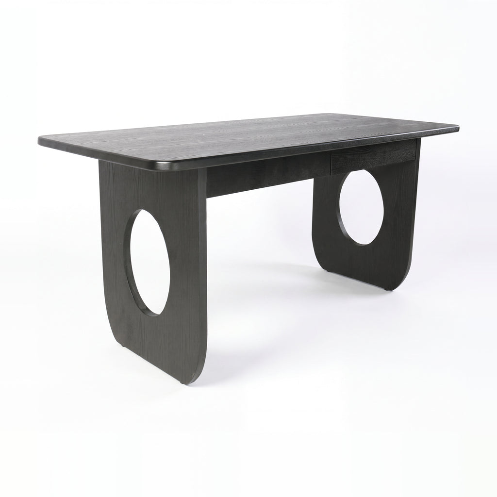 Elara 170cm Home Office Desk Black, three-quarter view on a white background showing the panel legs with oval cut-outs