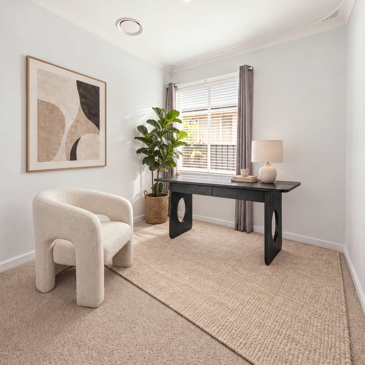 Elara 170cm Home Office Desk Black in a study with a cream boucle armchair and abstract wall art, wide view