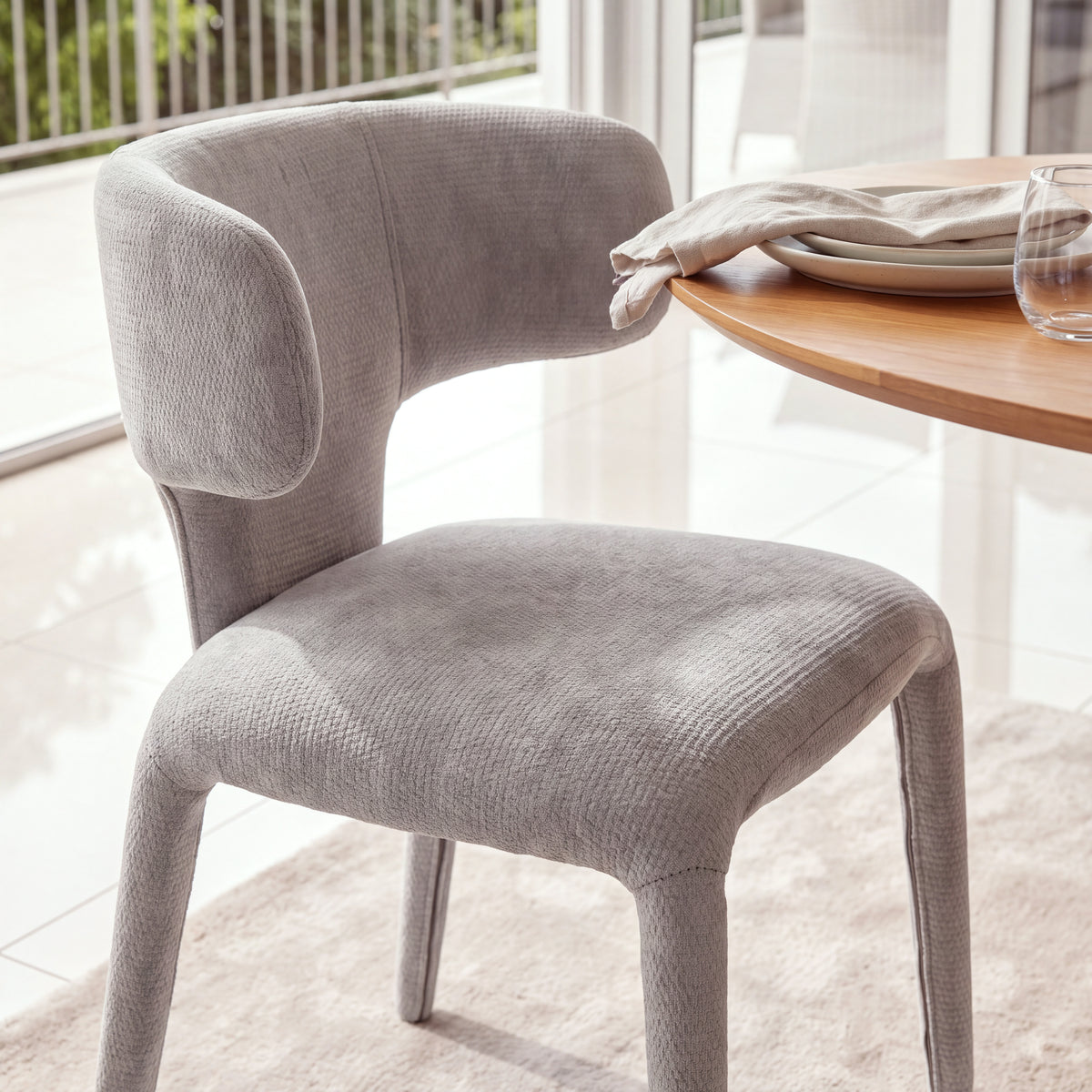 Emma 2pc Set Dining Chair Grey, close-up of the seat and curved backrest