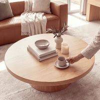 Erina 110cm Round Coffee Table Natural Oak, close-up of the tabletop with books and a coffee cup