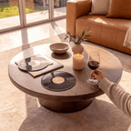 Erina 110cm Round Coffee Table Natural Walnut, close-up of the tabletop with vinyl records and a glass of wine