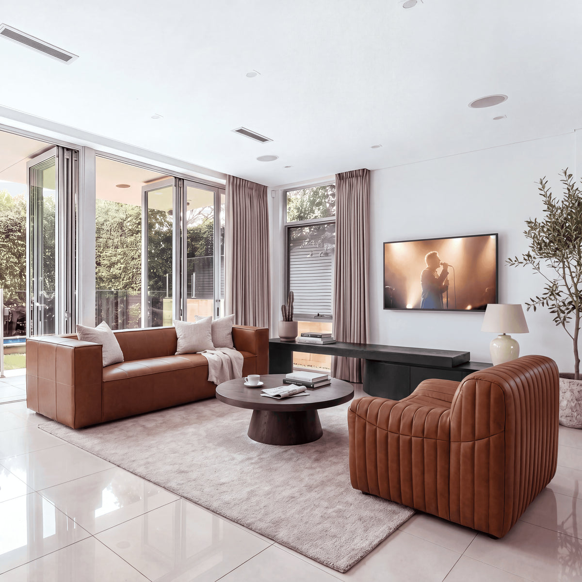 Erina 110cm Round Coffee Table Natural Walnut, in a living room, wide view