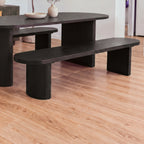 Eve 198cm Dining Bench Black beside a matching oval dining table in a bright dining room