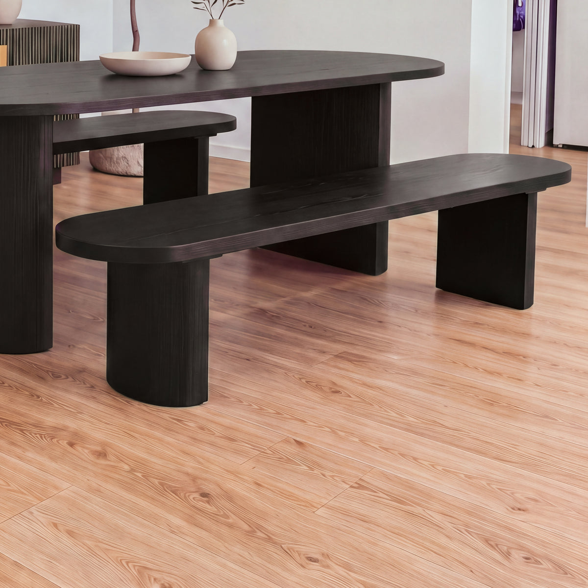 Eve 198cm Dining Bench Black beside a matching oval dining table in a bright dining room