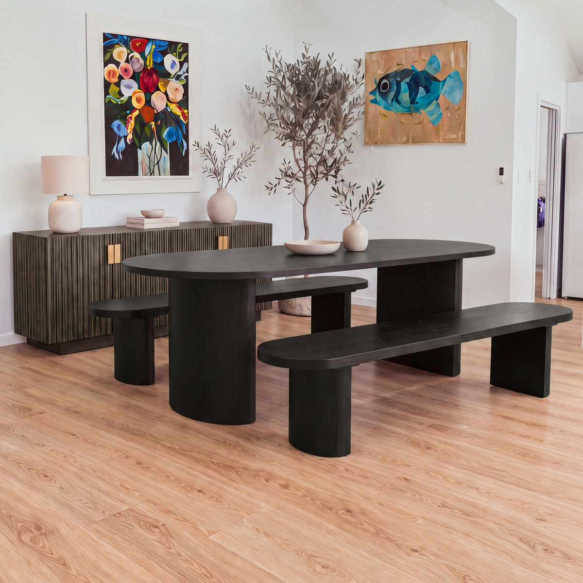 Eve 198cm Dining Bench Black with a matching oval dining table in a dining room under a floral painting, wide view