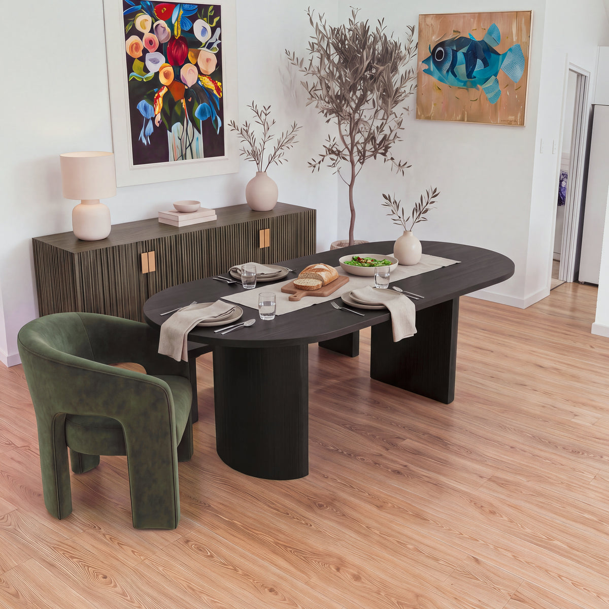 Eve 240cm Oval Dining Table Black set for lunch with plates, bread and salad, an armchair at one end, seen from above