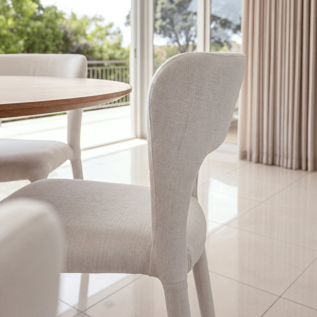 Frances 4pc Set Dining Chair Stackable Beige, close-up of the curved backrest and seat