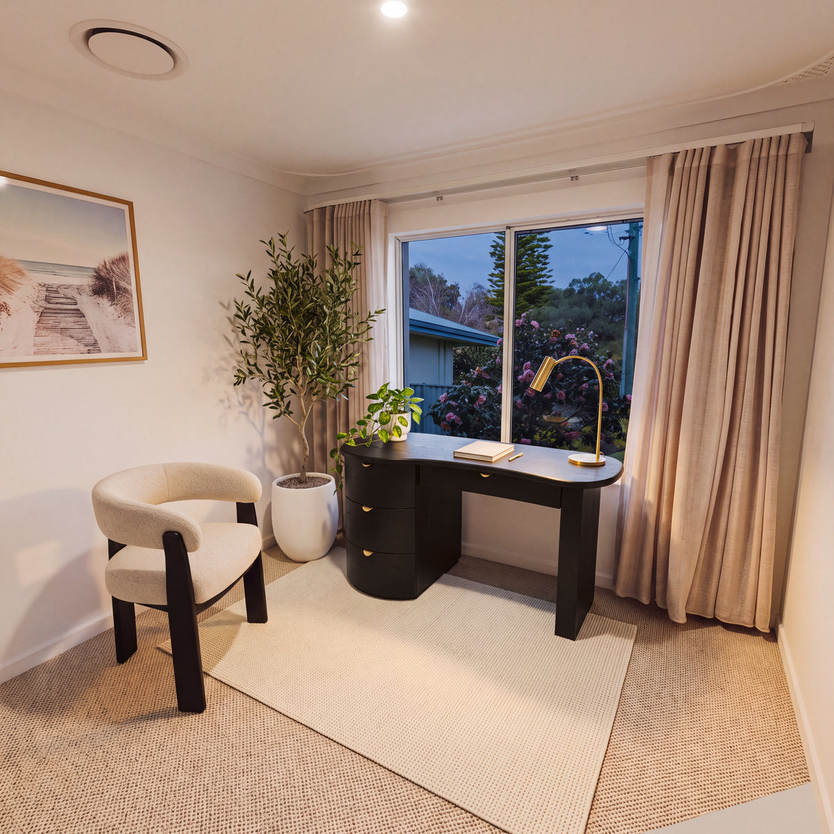 Golborne 150cm Home Office Desk Black in a study with a cream armchair and a beach print, wide view