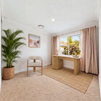 Golborne 150cm Home Office Desk Natural in a study with an upholstered chair, a potted palm and a beach print, wide view