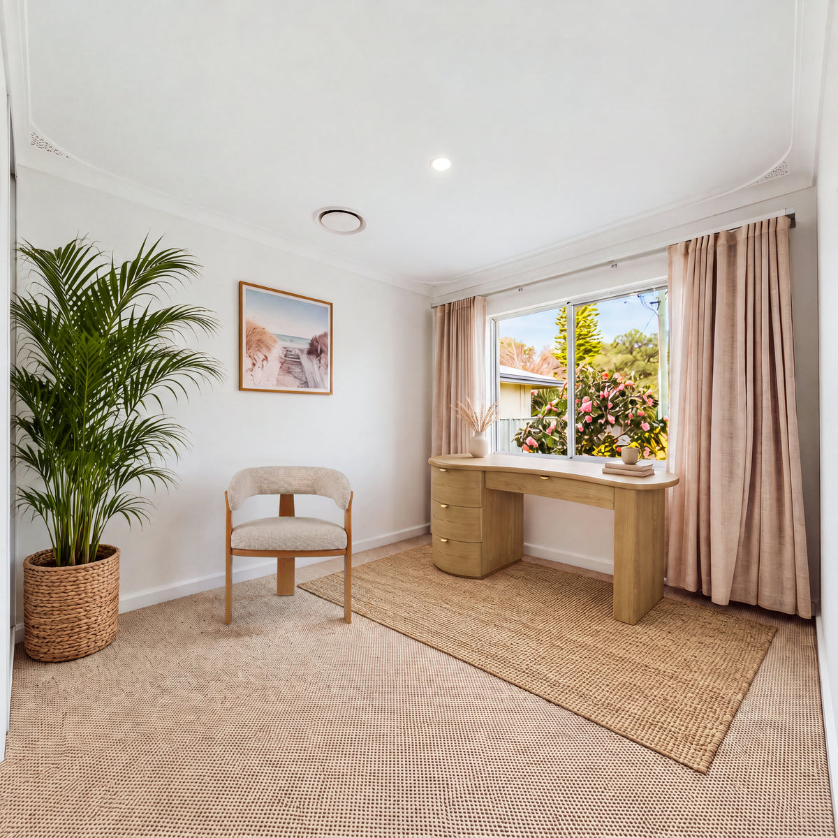 Golborne 150cm Home Office Desk Natural in a study with an upholstered chair, a potted palm and a beach print, wide view