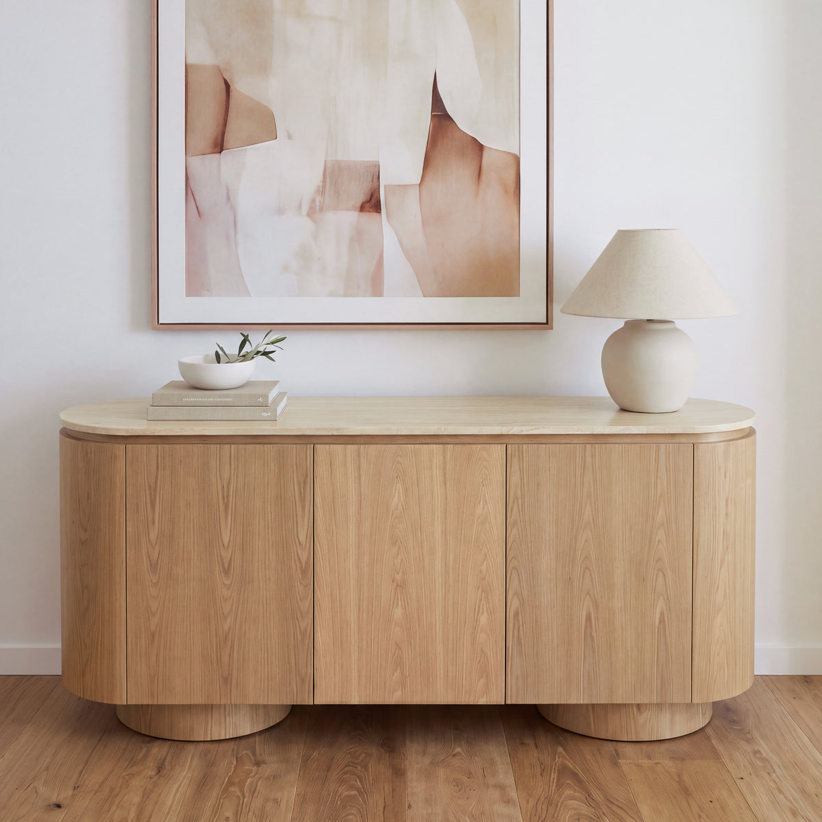 Hera 180cm Sideboard Buffet Table Natural, styled with artwork and a table lamp, front view