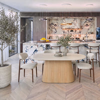 Hera 200cm Dining Table Natural, with dining chairs beside a marble kitchen island