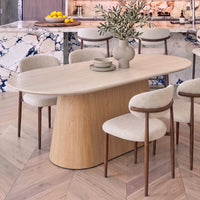 Hera 200cm Dining Table Natural, close view of the rounded end with dining chairs