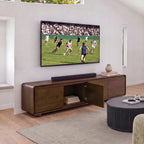 Hudson Jenny 220cm ETU Entertainment TV Unit Walnut with one door open showing books inside, under a wall-mounted TV