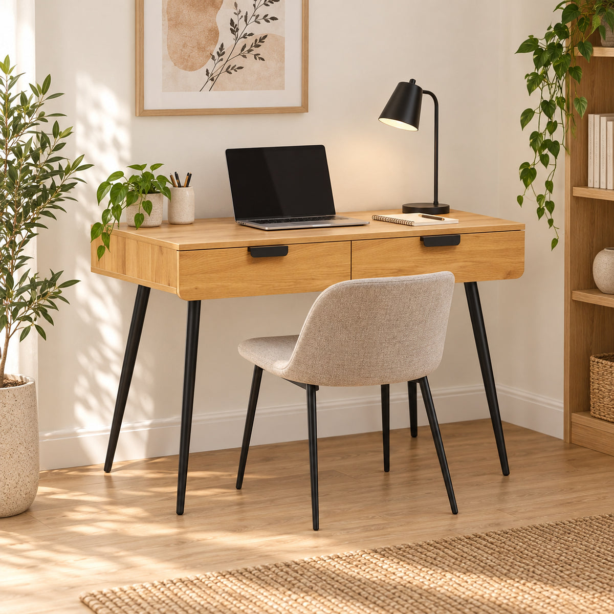 Jinan 110cm Study Desk Oak, in a home office with a chair and laptop