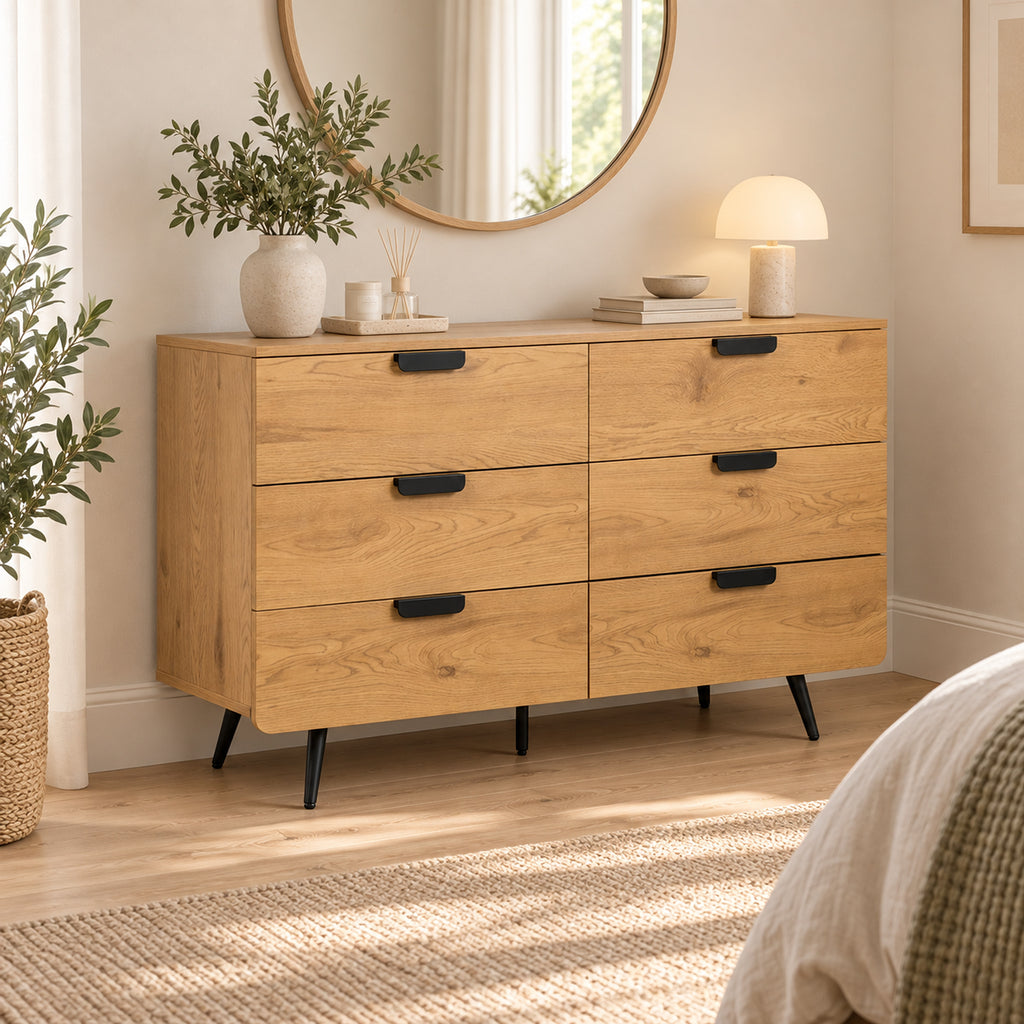 Jinan 120cm Dresser Chest of 6 Drawers Oak, in a bedroom beneath a round mirror