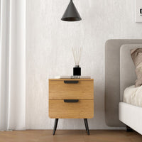 Jinan 2 Drawer Bedside Table Oak, beside a bed beneath a pendant light