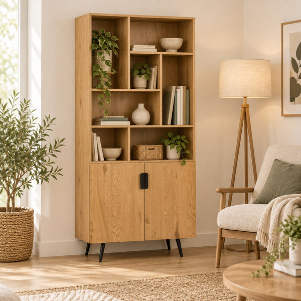 Jinan 80cm 2 Door Bookshelf Oak, in a living room styled with books and plants