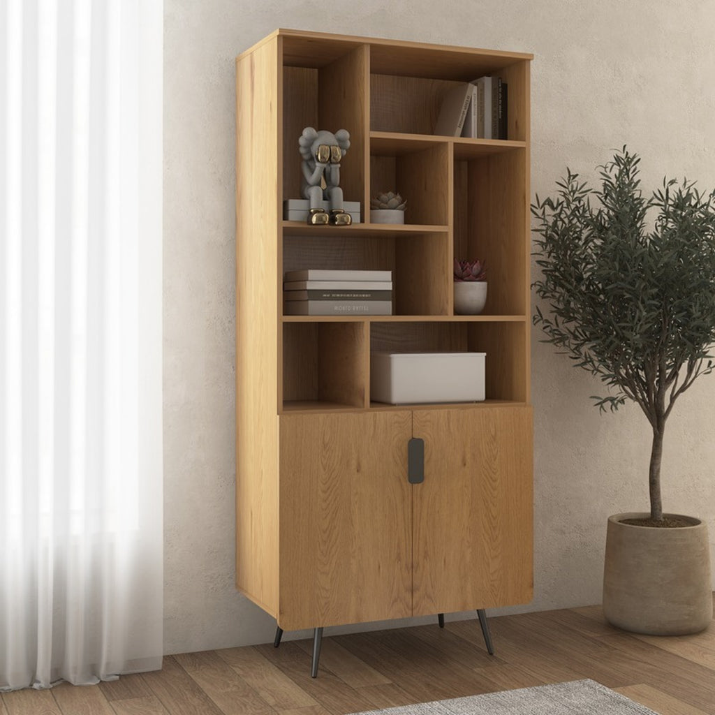 Jinan 80cm 2 Door Bookshelf Oak, in a room beside a potted olive tree