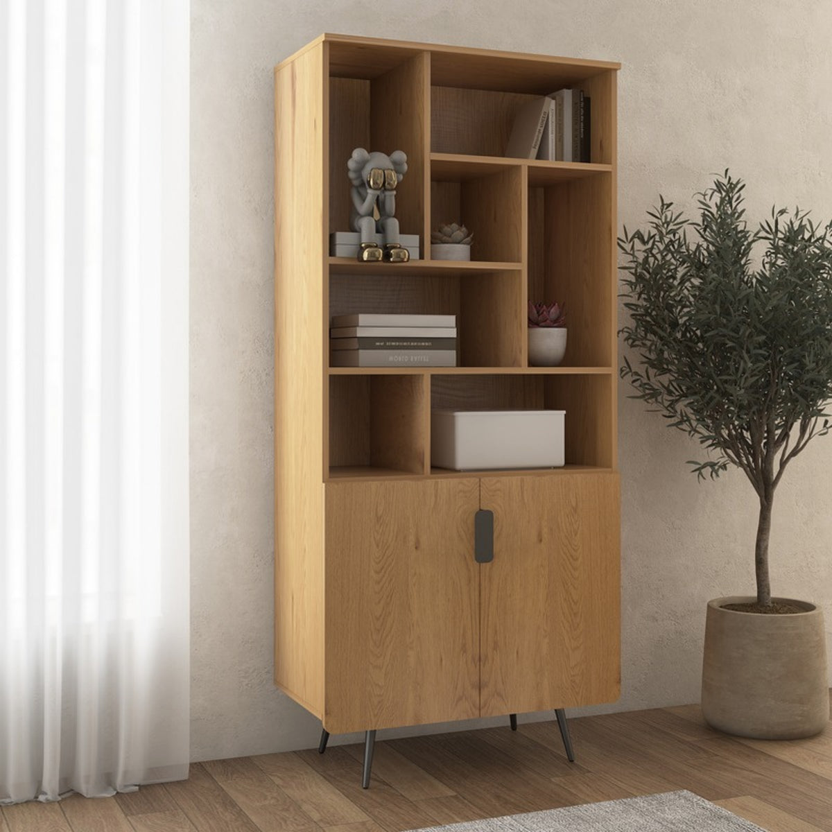 Jinan 80cm 2 Door Bookshelf Oak, in a room beside a potted olive tree