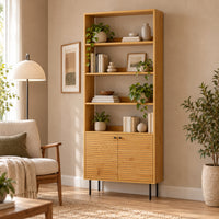 Line 80cm 2 Door Bookshelf Oak and Black, in a living room styled with books and plants