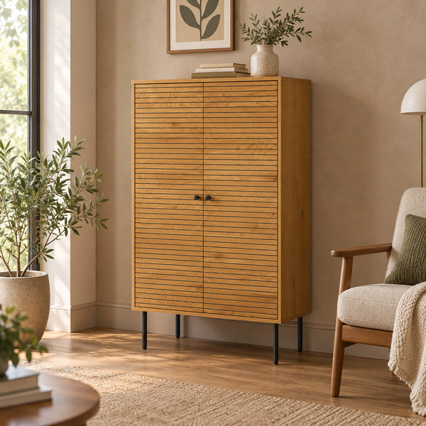 Line 80cm Highboard Storage Cabinet Oak and Black, in a living room beside an armchair