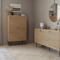 Line 80cm Highboard Storage Cabinet Oak and Black, in a living room beside a matching sideboard
