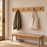 Line 80cm Wall Coat Rack Oak and Black, in an entry hallway with a jacket and tote bag on its knobs