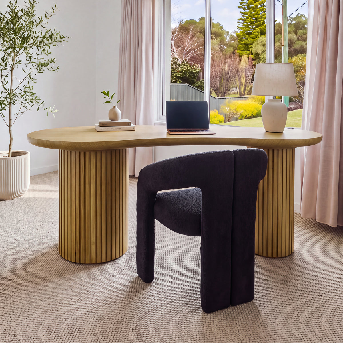 Marty 170cm Home Office Desk Natural in a study by a window with a dark upholstered chair, a laptop and a table lamp