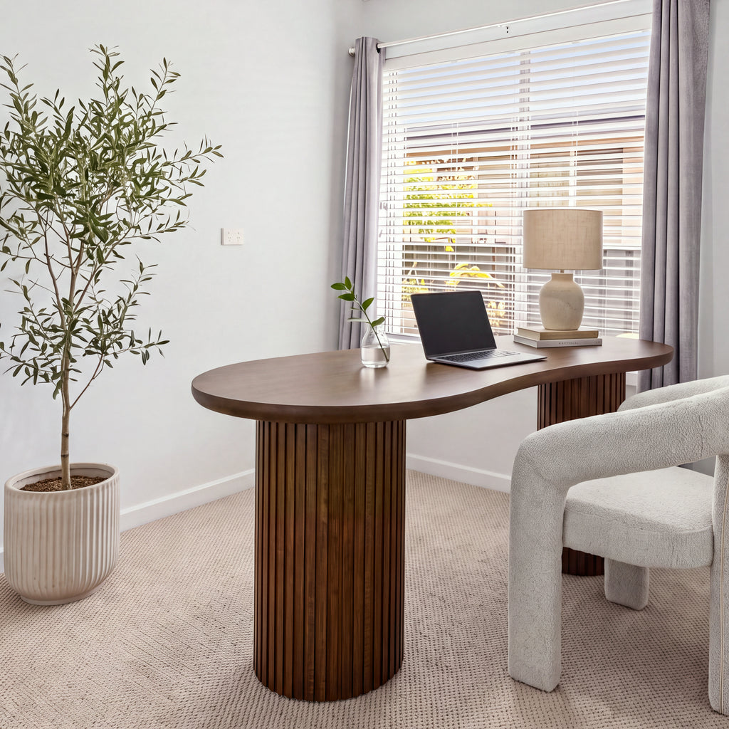 Marty 170cm Home Office Desk Walnut in a study by a window with a cream upholstered chair, a laptop and a table lamp
