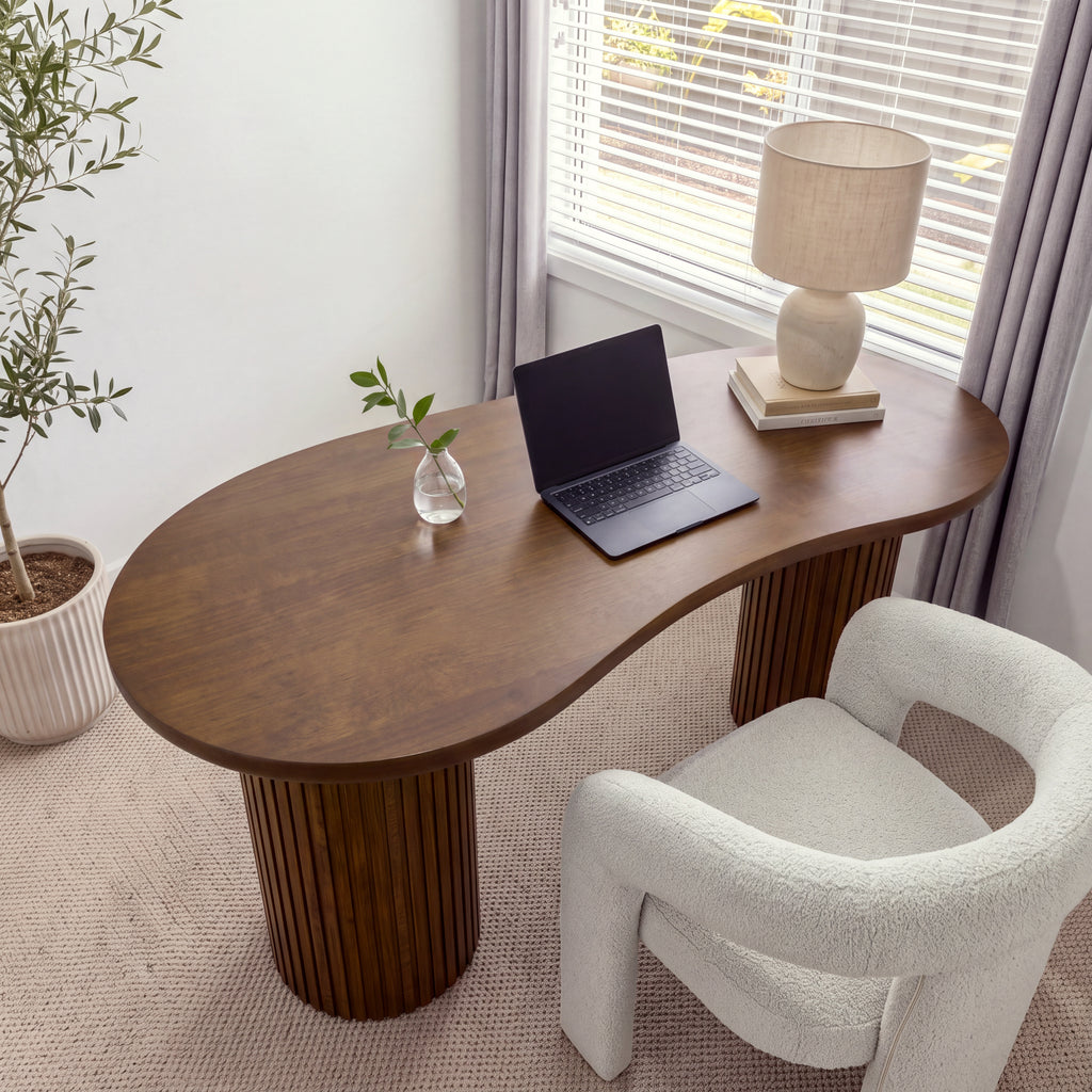 Marty 170cm Home Office Desk Walnut seen from above, showing the curved kidney-shaped top with a laptop, a vase and a lamp