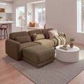 Paulie 270cm 3 Seater Modular Sofa with Ottoman Chocolate with the ottoman pushed against the left seat as a chaise, beside a round white fluted coffee table in a sunlit living room