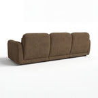 Paulie 270cm 3 Seater Modular Sofa with Ottoman Chocolate, rear three-quarter view on a white background showing the three back panels