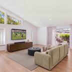 Paulie 270cm 3 Seater Modular Sofa with Ottoman Latte seen from behind in a living room facing a TV unit, wide view