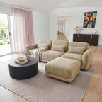 Paulie 270cm 3 Seater Modular Sofa with Ottoman Latte with the ottoman pushed against the right seat as a chaise, by sheer curtains