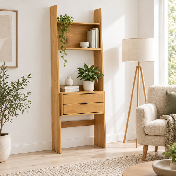 Scala 60cm 2 Drawer Bookshelf Oak, in a living room beside an armchair and floor lamp
