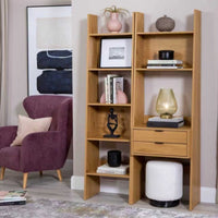 Scala 60cm 2 Drawer Bookshelf Oak, in a living room beside a matching bookshelf