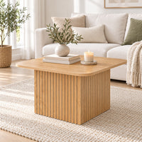Thomasville 60cm Square Coffee Table Oak, in front of a sofa in a living room