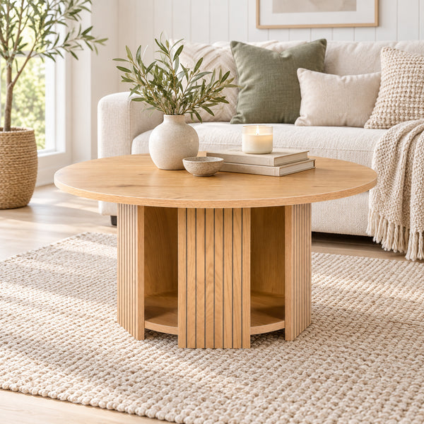 Thomasville 80cm Round Coffee Table Oak, in front of a sofa in a living room