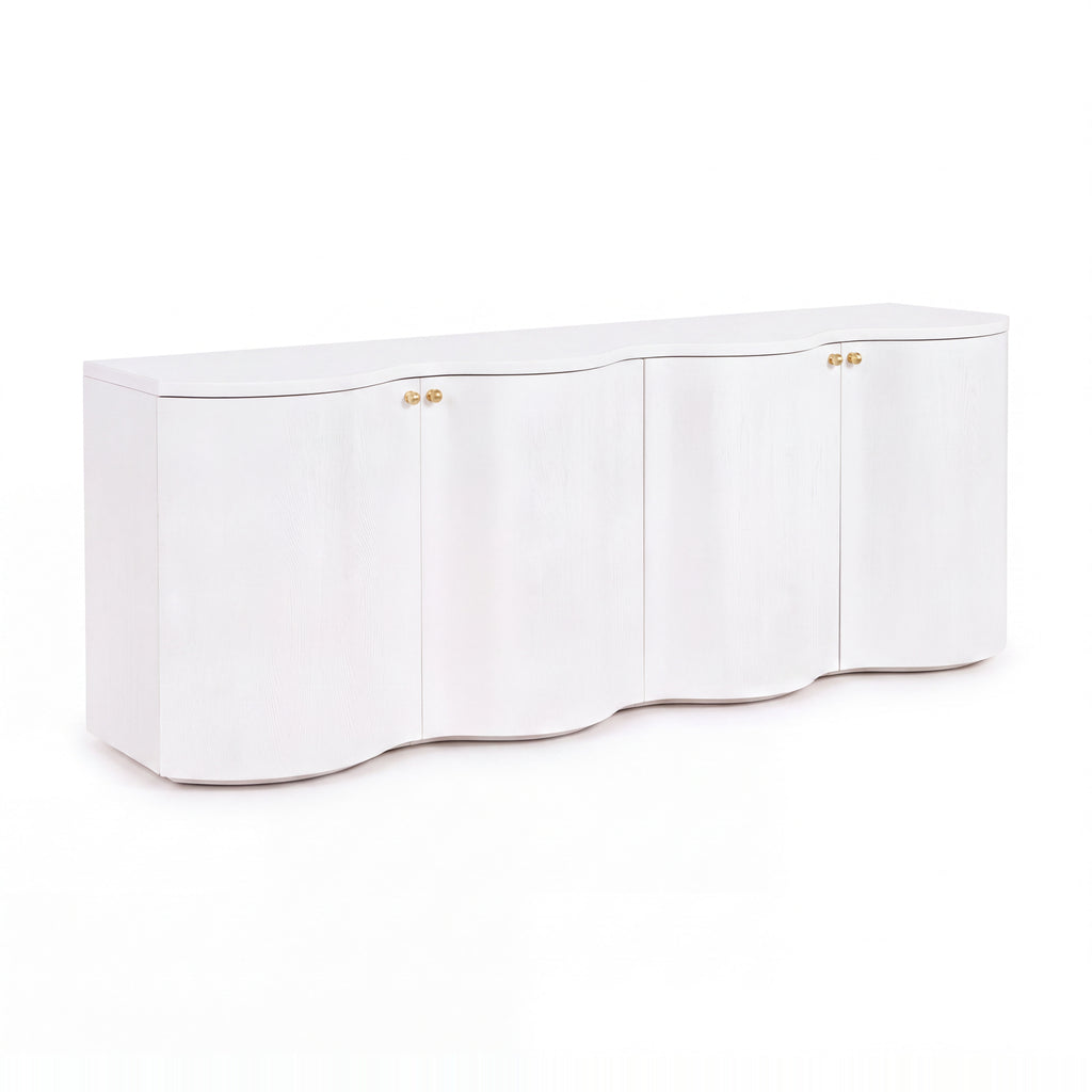 Wave 215cm white four-door buffet with a curved wave front and brass knobs, angled view on a white background